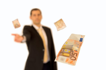 Business man handing a money with background whiteの写真素材