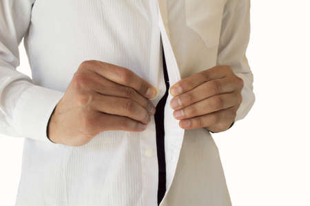 Detail view of  businessman adjusting her shirt buttonsの写真素材