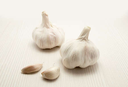 two garlic close up and wood backgroundの写真素材