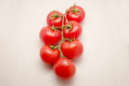 Lovely ripe cherry tomatoes, still on the plantの写真素材