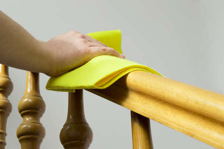 cleaning wooden railing の写真素材