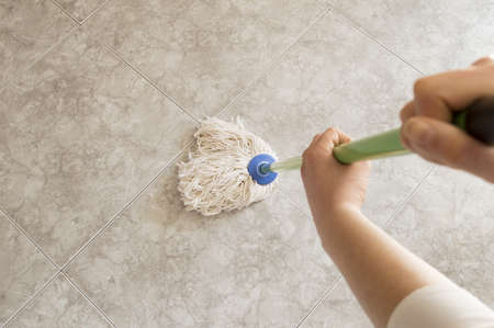 floor scrubbing with a mop seen from aboveの写真素材