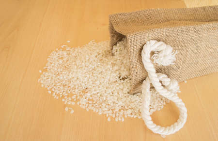 Pile of rice beans with wooden backgroundの写真素材