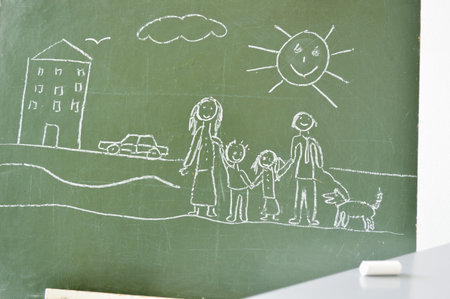 blackboard with a drawing of a child after drawingの写真素材