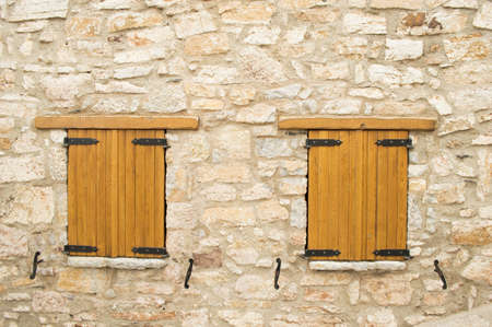 two closed wooden windowsの写真素材