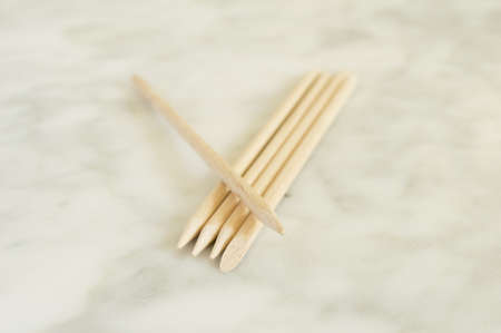Cuticle pushers on marble orange sticksの写真素材