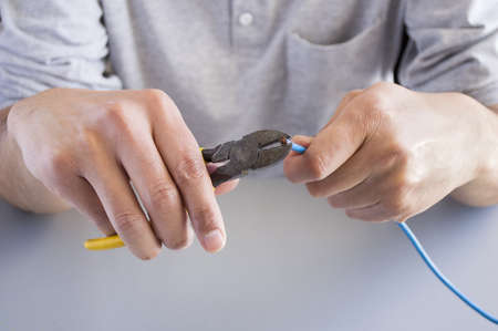 man working cable cutting の写真素材
