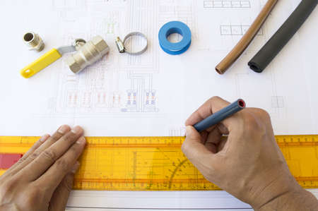 engineer designing plane installation of water and natural gasの写真素材