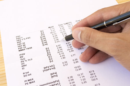 Businessman doing paperwork and reviewing the numbers