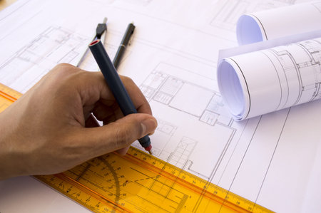 hands of an architect and working tools