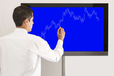 businessman presenting the graph of the market gainsの写真素材