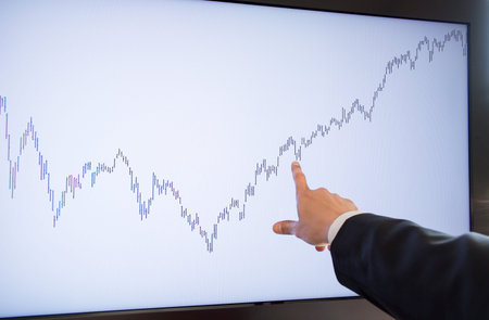 businessman pointing buys area monitorの写真素材