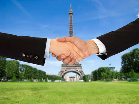 closing a deal with a handshake on a trip to Parisの写真素材