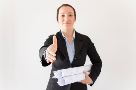 Handshake architect woman with focus on hand