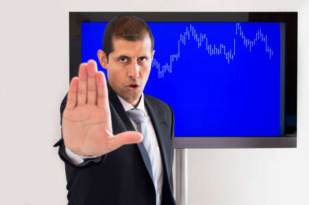 angry man signalling stop sign over graphの写真素材