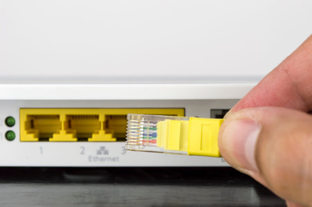 close up of a hand holding a cable internet online