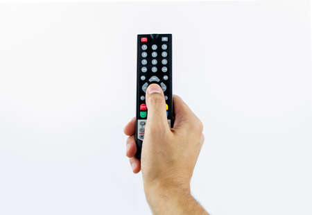 Hand holding television remoteの写真素材