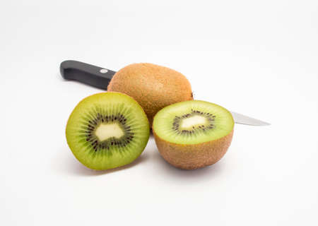 Two Kiwis fruits and knife with white backgroundの写真素材