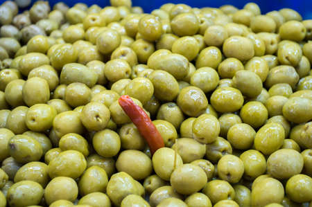 group ready to eat olives green with chilliの写真素材