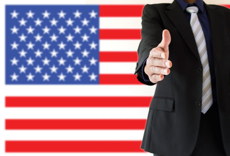 close up of handshake with USA flag
