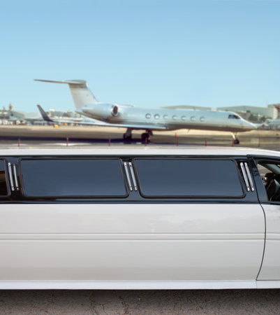 white limousine and private jet on landing strip