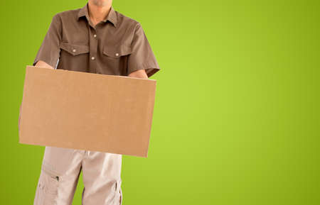 transportation worker carrying a packet with green backgroundの写真素材
