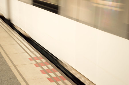 underground train leaving fast the station blurred by the velocityの写真素材