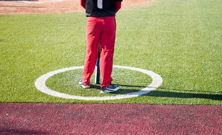 baseball player waiting to take a swing