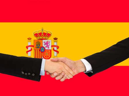Handshake of a woman and business men in Spainの写真素材