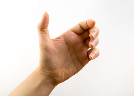 Close up of hand holding with white の写真素材