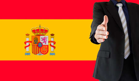 Close up of handshake with spain flagの写真素材