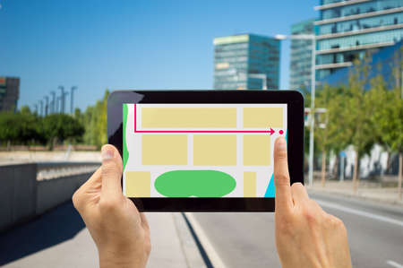 tourist looking at digital tablet a map of the city Cityの写真素材