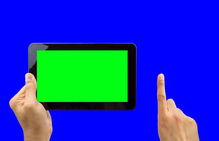 man holding digital tablet computer with chroma key blue and greenの写真素材