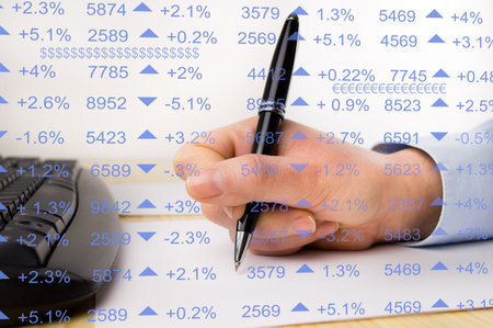 close up of hand of man doing my research and calculating