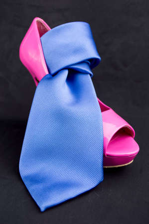 womanish pink shoe with neck blue tieの写真素材