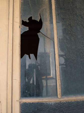 close up of broken window of the house of a beggarの写真素材