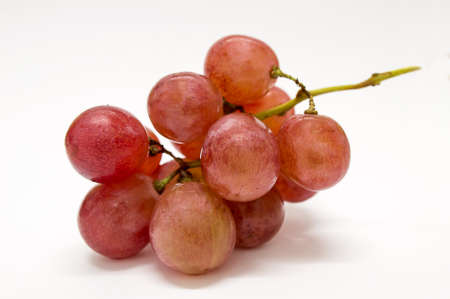 fresh red grapes isolated on a white backgroundの写真素材