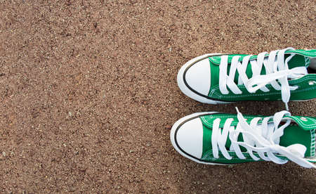 green shoes on the asphalt with copy spaceの写真素材