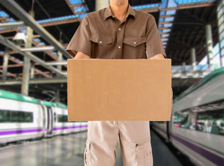 Man offering his goods transportation service from walk from a train stationの写真素材