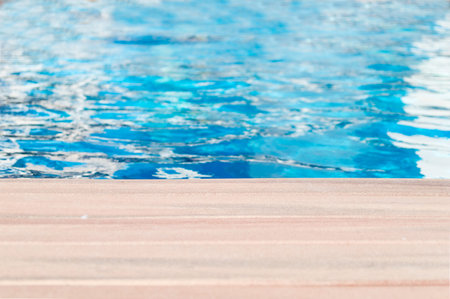 Swimming pool and wooden deck ideal for backgrounds