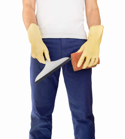 cleaner standing and holding squeegee and sponge to make the workの写真素材