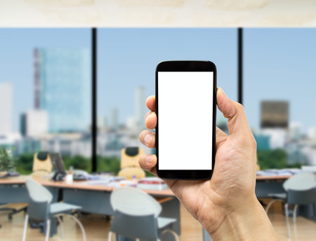 Businessman surfing with one smartphone at the office