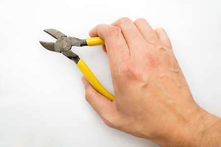 hand holding nippersの写真素材