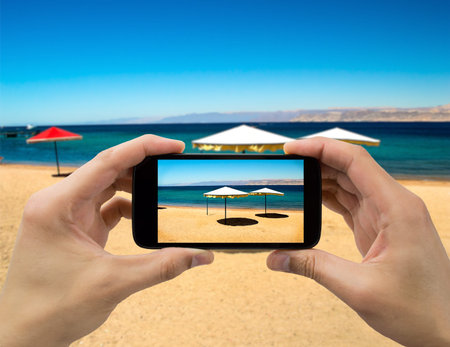 taking a photo of the beach