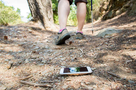 hiker who lost the smartphone on the roadの写真素材