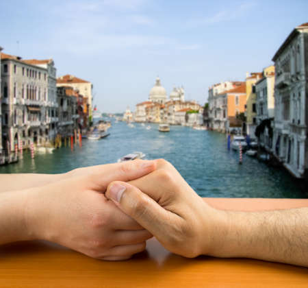 female hands grasping a man in concept of love in Veniceの写真素材