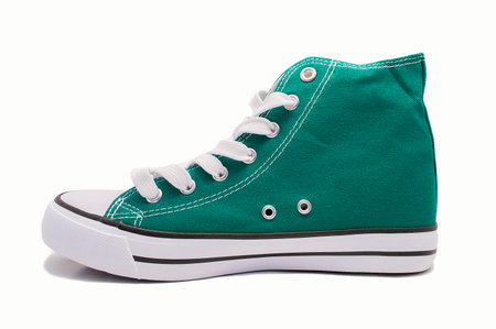 profile view of green sneaker isolated on a white backgroundの写真素材