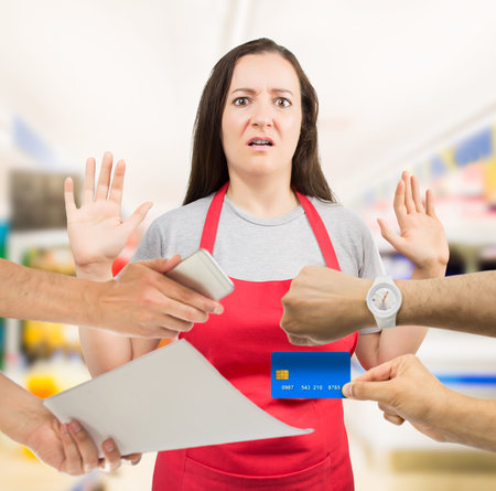 saleswoman with overworked at the supermarketの写真素材