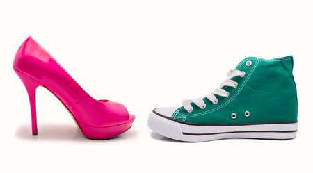 choice between feminine shoe and sneaker by profile over white background choice between feminine shoe and sneaker by profile over white background