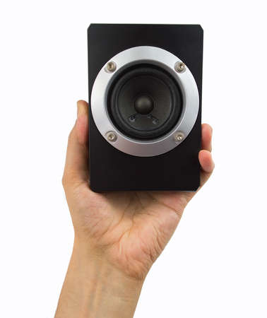 hand holding a black speaker on white backgroundの写真素材